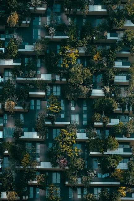 pexels-photo-4322027-4322027 Facade of a contemporary building with lush greenery in Milan's Bosco Verticale.